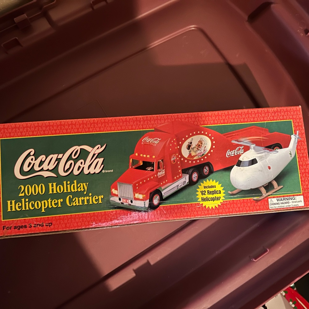 NIB year 2000 collectible Christmas Coca-Cola hauler w/ mini helicopter inside